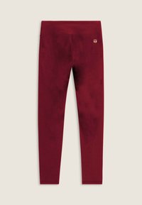 Leggings bordeaux realizzati in tessuto morbido con una superficie liscia, caratterizzati da una vita alta e un piccolo logo accento vicino alla vita.