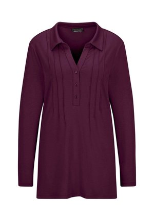 Langärmliges Poloshirt in tiefem Lila, aus weichem Stoff gefertigt, mit einer geknöpften Knopfleiste und vertikalen Falten entlang der Vorderseite.