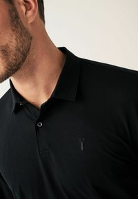 Next Polosärk - black