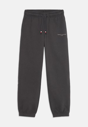 Pantalons de survêtement gris foncé en mélange de coton. Caractéristiques : taille élastique avec cordon de serrage, ourlets de chevilles cintrés et logo blanc à l'avant.