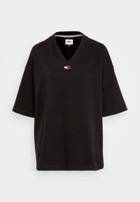 T-shirt nera a V in cotone. Caratterizzata da maniche corte, un piccolo logo e una vestibilità rilassata. Tessuto liscio e design semplice.
