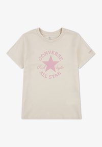 Krämfärgad bomulls-t-shirt med en rosa stjärnlogotyp samt texten "CONVERSE" och "ALL STAR", korta ärmar och rundad halsringning.
