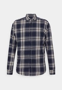 Camicia a maniche lunghe a quadri blu e crema, con bottoni sul davanti, colletto e maniche a polsino. Il tessuto sembra tessuto con un motivo intrecciato.