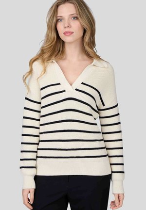 Pull crème avec des rayures horizontales bleues marine, col en V, poignets et ourlet côtelés. Texture tricotée. Conçu pour une coupe décontractée.