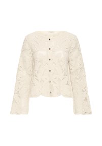 Cardigan en maille crochet couleur crème, manches longues, boutonnage devant et bord festonné.