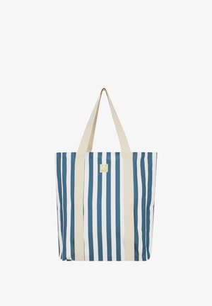 Sac fourre-tout rayé bleu et blanc en tissu durable, avec deux poignées couleur crème et une petite étiquette logo sur un côté.