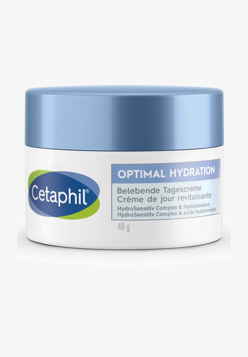 Cetaphil feuchtigkeitsspendende Creme in einem weißen Behälter mit einem hellblauen Deckel. Das Etikett ist in mehreren Sprachen beschriftet. Enthält 48 g.