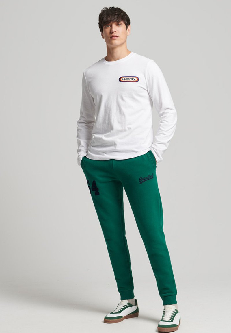 Superdry Tracksuit bottoms emerald green/green Zalando.co.uk