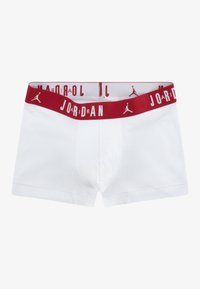 White boxer briefs with a red elastic waistband, featuring repeated "JORDAN" text and a logo. Soft fabric with a fitted design.
