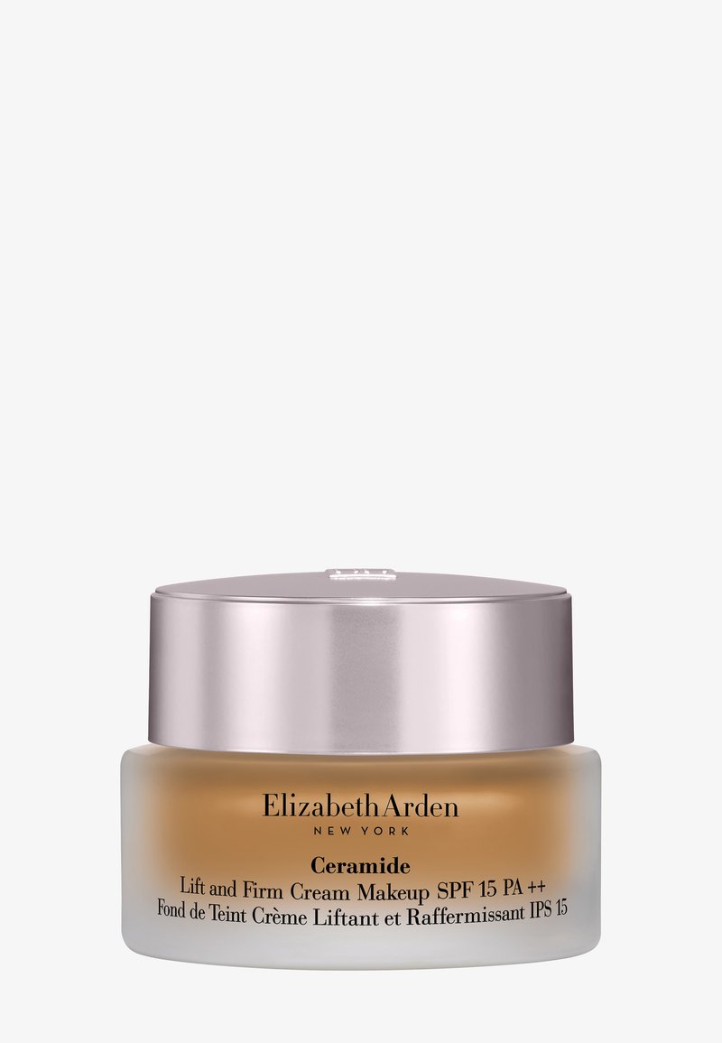 Barattolo per trucco Elizabeth Arden Ceramide Lift and Firm Cream con SPF 15, contenitore in vetro satinato e tappo metallico su sfondo uniforme.