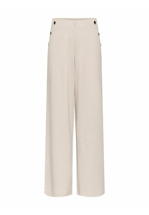 Beżowe spodnie z szerokimi nogawkami i wysokim stanem, z ozdobnymi guzikami po bokach, prezentowane na białym tle.