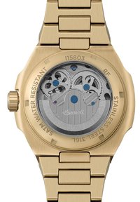 Vergulde roestvrijstalen horloge met een zichtbaar mechanisch uurwerk, blauwe accenten, gestructureerde zilveren tandwielen en gegraveerde details op de achterzijde.