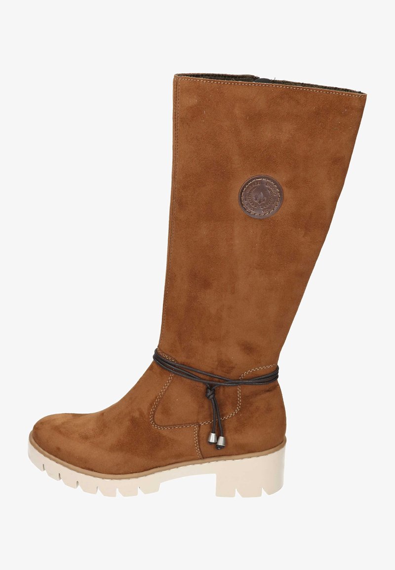 Brown suede knee-high boot with a textured finish, featuring a logo patch and a decorative tied cord around the ankle. Chunky white outsole.