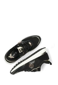 Black textile sneakers with gold accents, featuring a mesh upper, contrasting white sole, and a textured rubber outsole for grip.