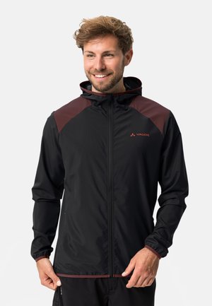 Black lightweight jacket with maroon accents, zip closure, and hood. Made of textured fabric with elastic cuffs and hem for a fitted look.