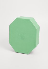 Boîte octogonale vert menthe en papier texturé avec un logo de cygne embossé sur le devant, dessus plat et bords nets.