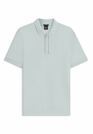 Polo shirt azzurro chiaro realizzato in cotone, con zip corta e colletto classico. Ha maniche corte e dettagli di design minimalisti.