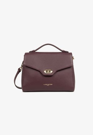 Dark purple leather handbag with top handle, gold twist-lock closure, detachable shoulder strap, and "Lancaster Paris" logo in gold lettering.