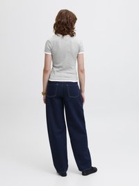 Grey cotton t-shirt with short sleeves and white trim, paired with dark blue wide-leg denim jeans featuring rear pockets.