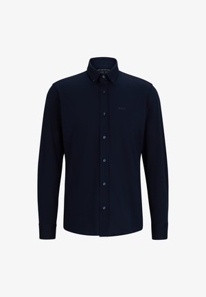Camisa de manga longa azul-marinho feita de uma mistura de algodão. Apresenta um colarinho abotoado, botões na frente e um logótipo em relevo discreto no peito.