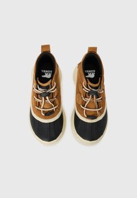 Brown and black waterproof shoes with rubber soles, featuring elastic laces and textile panels. Smooth black toecap with contrasting tan accents.
