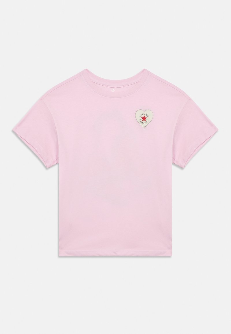 Ροζ ανοιχτό ροζ κοντομάνικο T-shirt με έμπλαστρο λογότυπου Converse All Star σε σχήμα καρδιάς στην αριστερή πλευρά του στήθους.