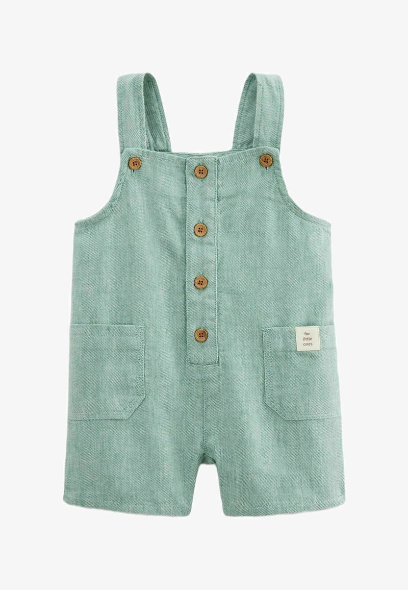 Combinaison légère vert clair pour tout-petit avec bretelles, cinq boutons en bois à l'avant, deux poches avant et une petite étiquette "pour les petits".