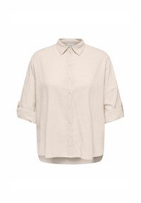 Chemise beige à manches longues avec boutons, col et poignets retroussés, en tissu léger texturé.