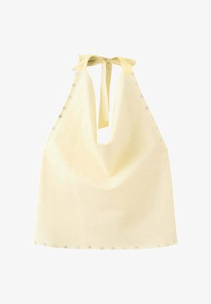 Haut dos nu jaune clair avec un profond décolleté en V, noué au cou, et petits clous décoratifs le long des côtés et de l'ourlet inférieur.