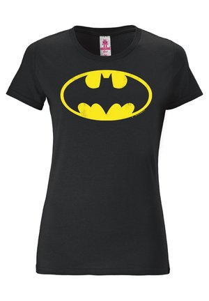 Black cotton t-shirt featuring a large, distressed yellow Batman logo at the center. Classic crew neck with short sleeves.