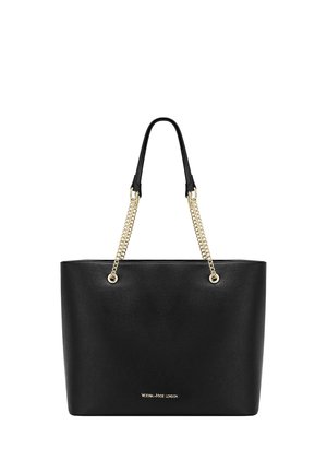 Czarna skórzana torba typu tote z złotym łańcuszkiem i skórzanymi uchwytami, z małym złotym logo „Victoria Hyde London” na przedniej części.