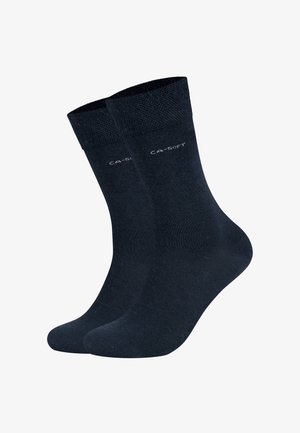Chaussettes en coton bleu marine foncé avec des bords côtelés, texture lisse et un logo subtil près de la partie supérieure. Longueur complète avec renforcements au niveau des orteils et du talon.