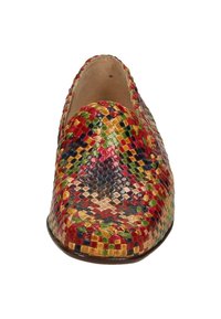 Woven slip-on shoe featuring multiple colors, predominantly red, yellow, green, and blue. Rounded toe with smooth leather interior.