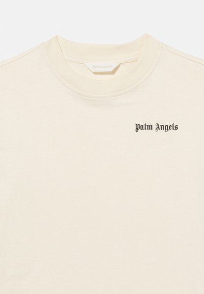Μπεζ μπλουζάκι με στρογγυλή λαιμόκοψη και μικρό μαύρο λογότυπο "Palm Angels" στο επάνω αριστερό μέρος του στήθους.