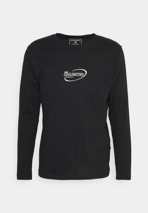 Sort langærmet t-shirt lavet af bomuld, med et hvidt grafisk logo der står "UNLIMITED 2022" på forsiden. Standard crew neck design.