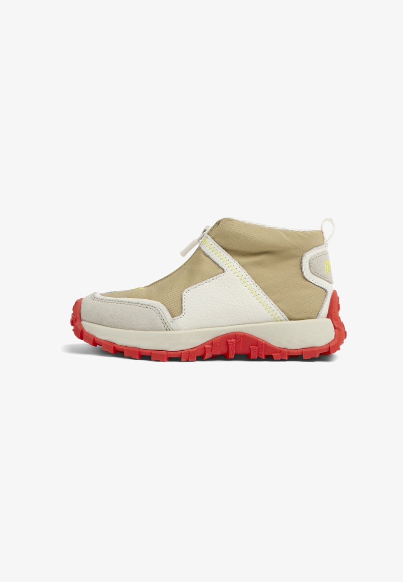 Beige and white mid-top shoe with a textured upper, red rubber sole, and side zipper. Features a yellow accent and stitched details.