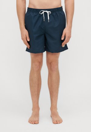 Marine zwemshorts met een verticaal gestreept patroon, elastische taille en witte trekkoord. Gemaakt van lichtgewicht, sneldrogend materiaal.