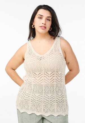 Beige knitted tank top featuring a chevron pattern, v-neckline, and scalloped hem, made from a breathable, airy material.