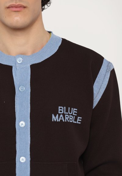 Black cardigan with light blue ribbed neckline and shoulder accents. Features three buttons and "BLUE MARBLE" embroidered on the chest.