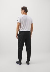 Lotto TRAINING PANT - Træningsbukser - caviar