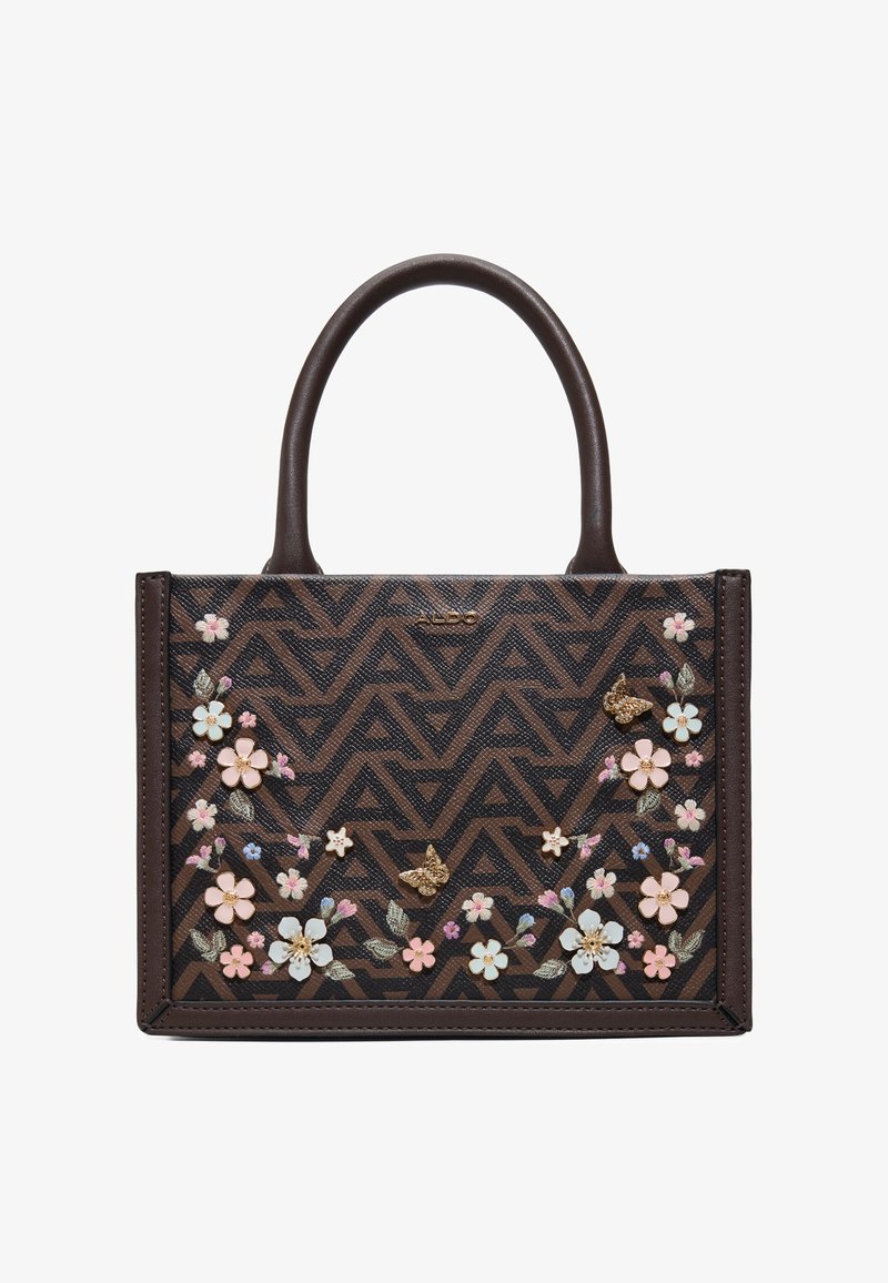 Sac à main marron avec motif géométrique foncé, décoré d'ornements floraux roses et blancs ainsi que de papillons, doté de deux poignées supérieures.