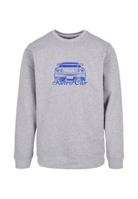 Gray sweatshirt with long sleeves, featuring a blue graphic of a retro car and the text "Retro Car" beneath the design. Soft fabric texture.