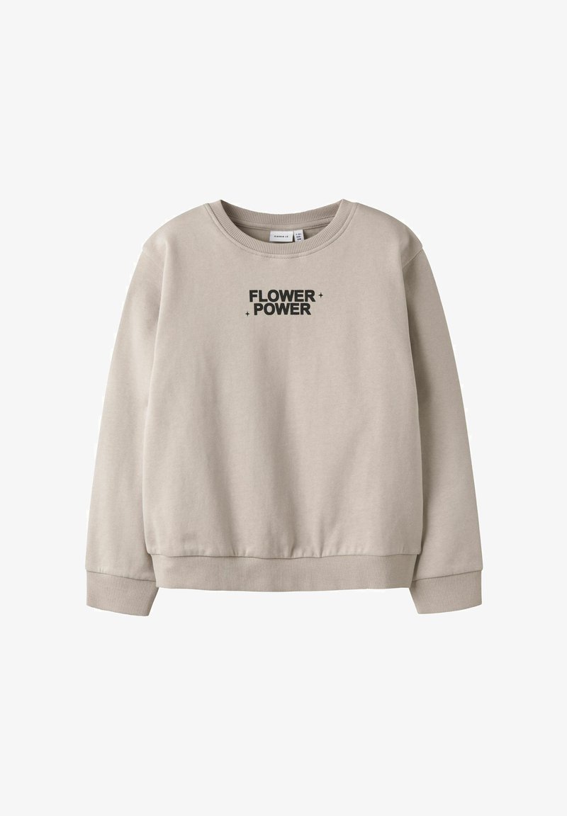 Sweat-shirt beige à col rond avec poignets et ourlet côtelés, arborant un texte noir « FLOWER POWER » et de petites étoiles en accent sur la poitrine.