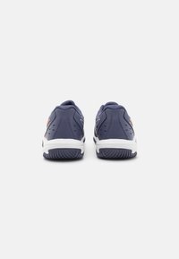 Navy athletic shoes with a textured finish, featuring a white midsole and contrasting orange accents. Rounded heel and durable rubber outsole.