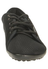 Black athletic shoe featuring a breathable mesh upper, round toe, and laces. The sole has dimples for traction. Lightweight design.