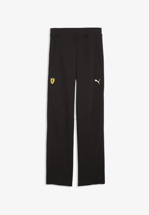 Pantalones deportivos negros con una textura suave, cintura elástica, bolsillos laterales y un logo blanco de Puma con un emblema amarillo de Ferrari en el muslo izquierdo.