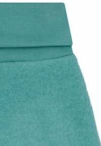 Pantaloni joggers turchesi con una morbida trama in feltro e una vita a coste. I materiali creano un design caldo e confortevole, adatto per l'abbigliamento casual.