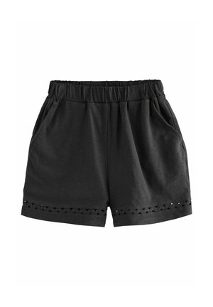 Zwarte shorts met elastische taille, zijzakken en decoratieve driehoekige uitsparingen bij de zoom aan beide benen.