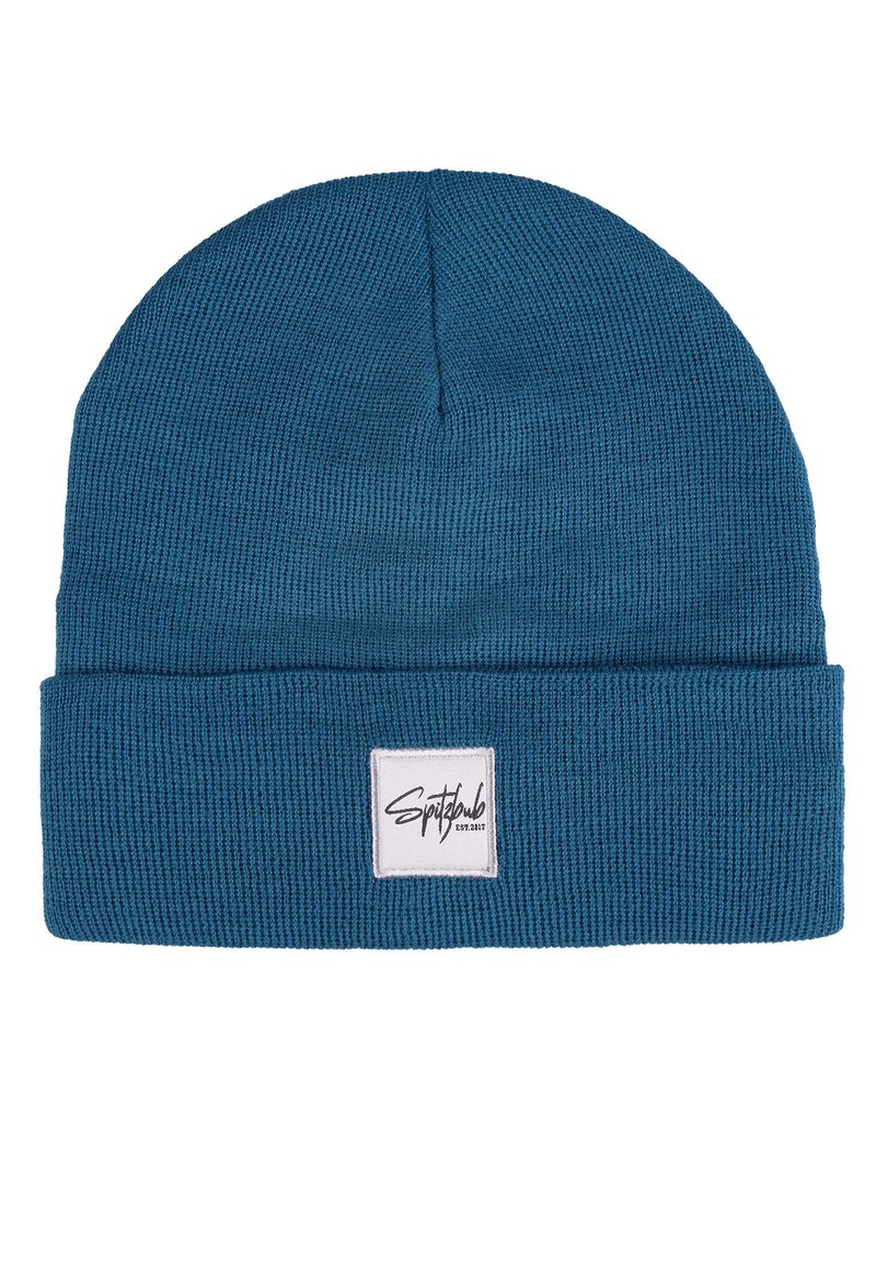 Knitted beanie hat in teal blue with a ribbed texture. Features a folded cuff and a square logo patch on the front.