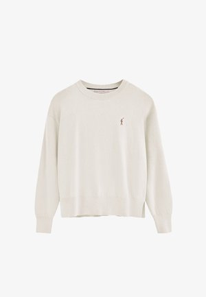 Cream-colored sweater with long sleeves, ribbed neckline and hem. Features a small brown embroidered logo on the left chest. Soft texture.